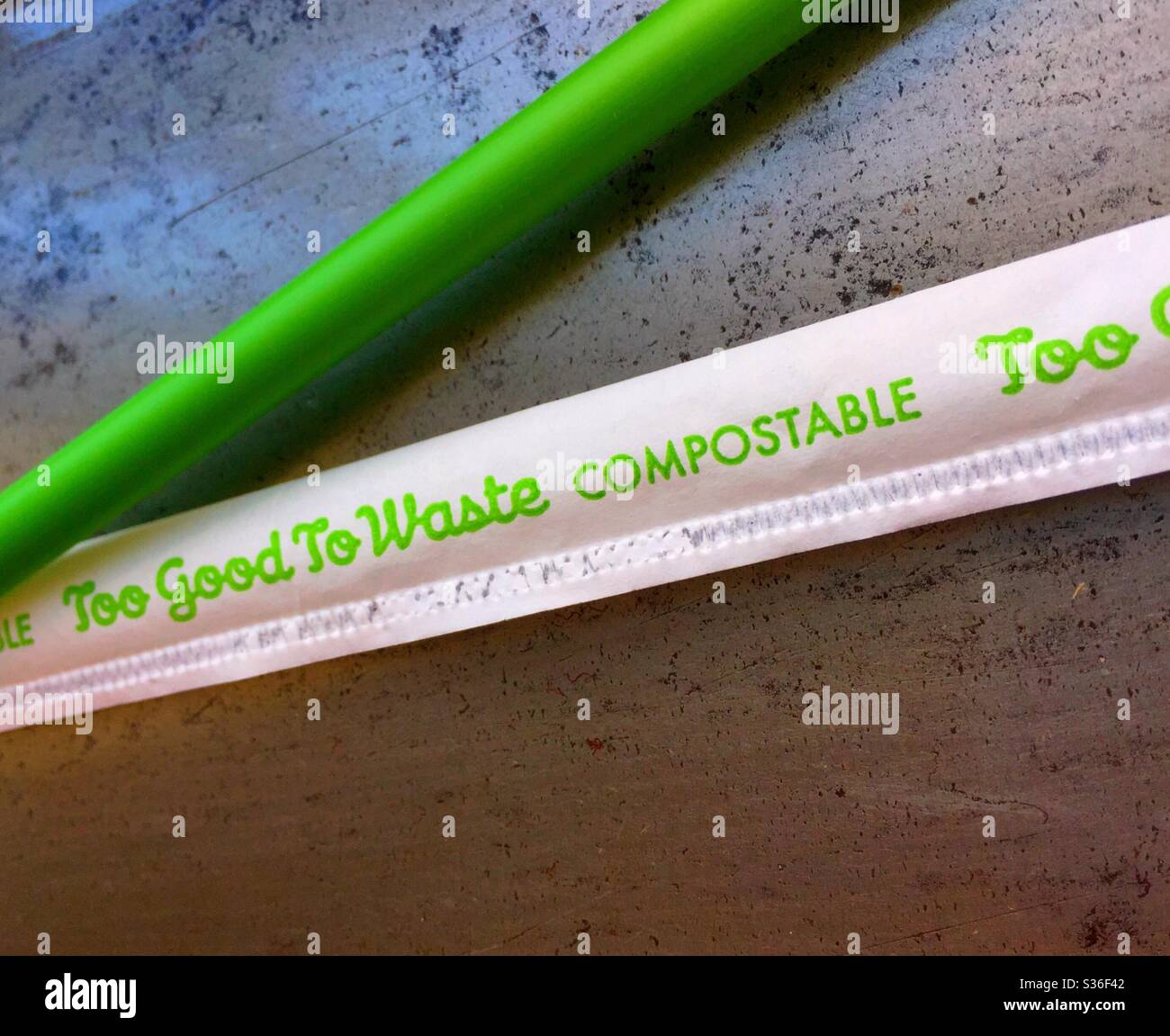 Close up of a green PLA straw, brand-name too good to waste, USA - Smartphone Captured Stock Image