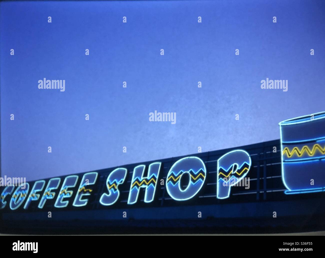 Neon coffee shop sign blue sky dusk South Carolina roadside Attraction Stock Photo