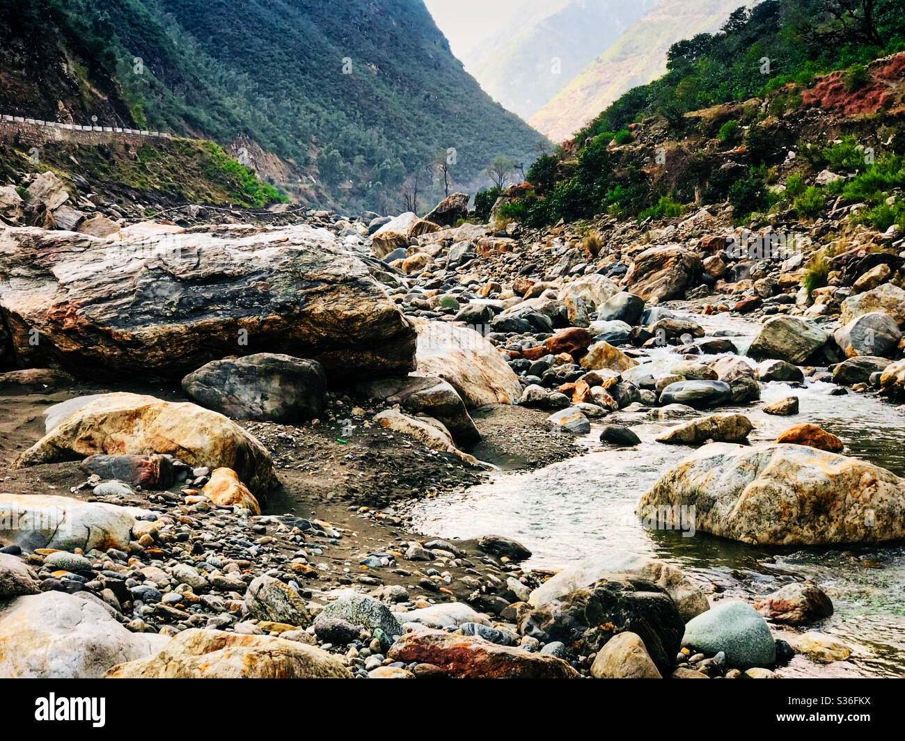 A wild stream of river between the mountains near Gilgit, Baltistan. Stock Photo