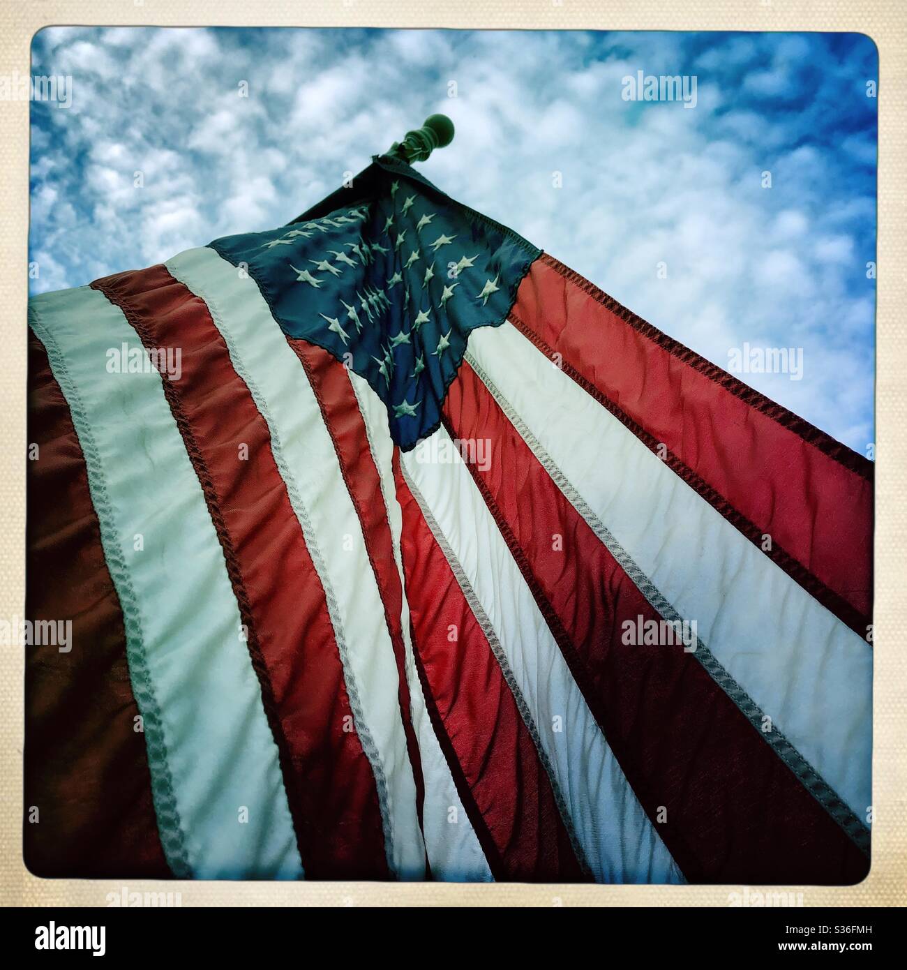 Low angle view of American flag on display for Memorial Day - Smartphone Captured Stock Image