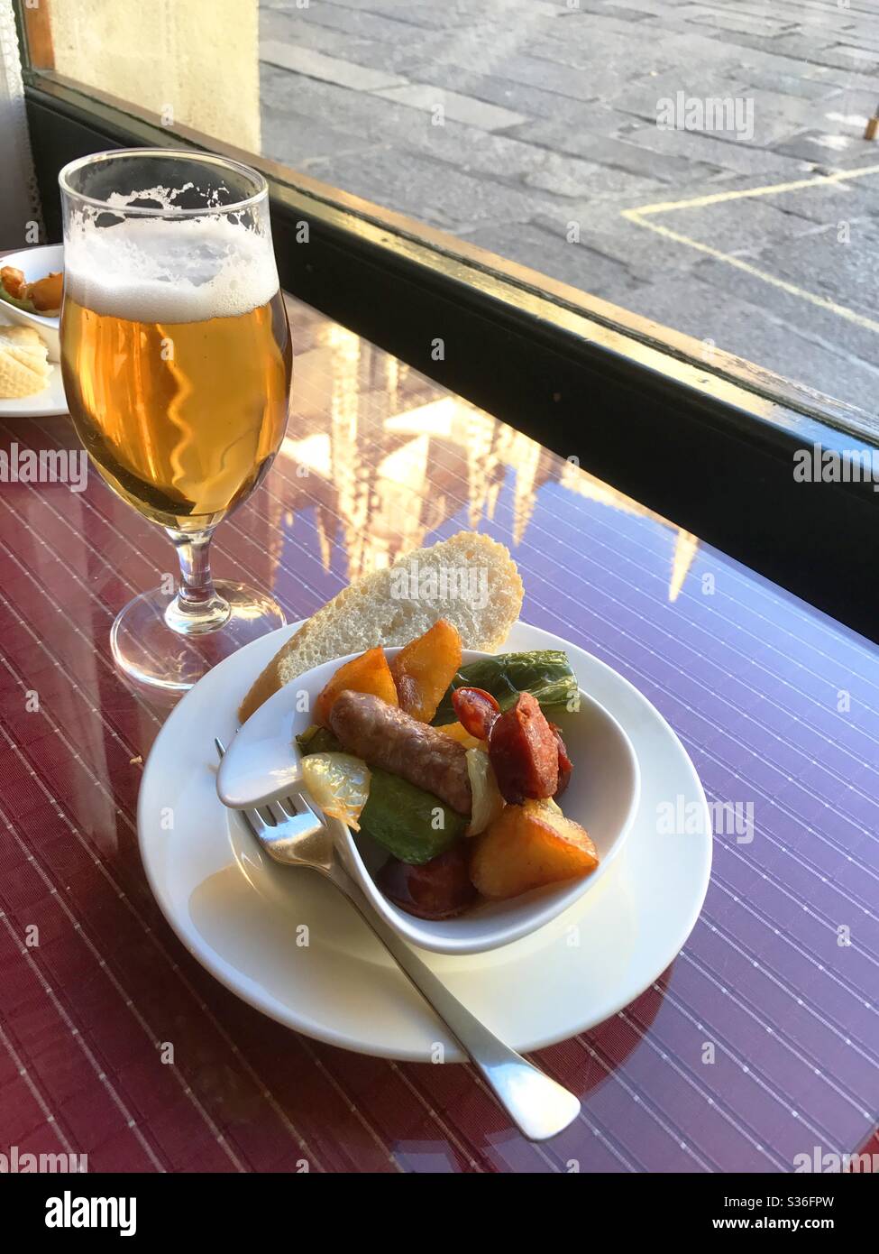 Glass of beer and tapa. Spain. - Smartphone Captured Stock Image
