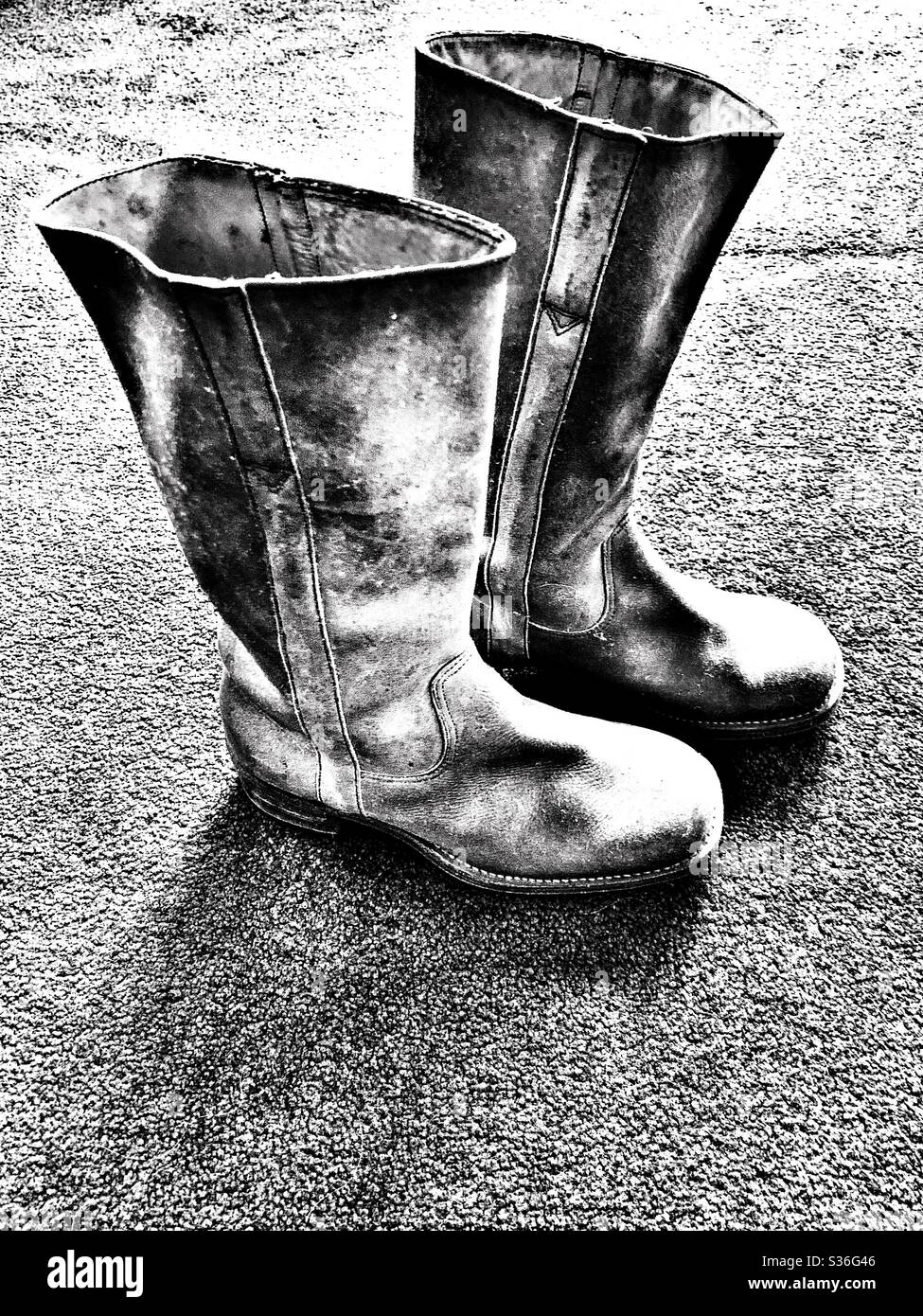 Black and white of Cowboy style leather boots from the 1970s - Smartphone Captured Stock Image