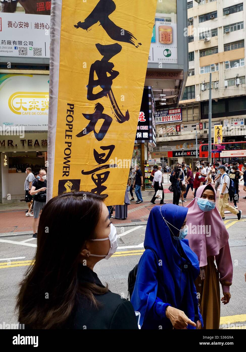 Domestic helpers and hongkongers in Causeway Bay on a day of political unrest in Hong Kong. Stock Photo