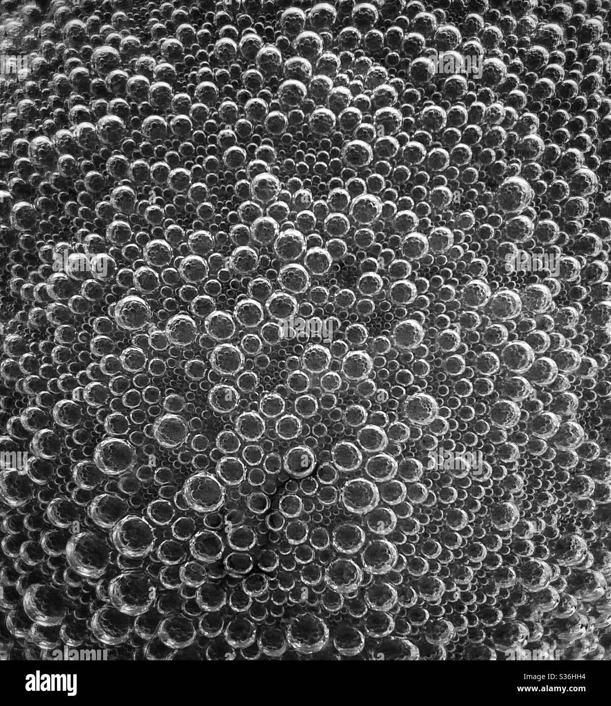 When an acid attacks an alkali a gas called carbon dioxide is produced. Here are hundreds of small carbon dioxide gas bubbles, creating an interesting graphic image. Photo ©️ COLIN HOSKINS. - Smartphone Captured Stock Image