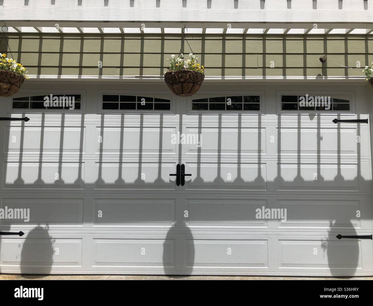 Shadows On A Garage Door - Smartphone Captured Stock Image