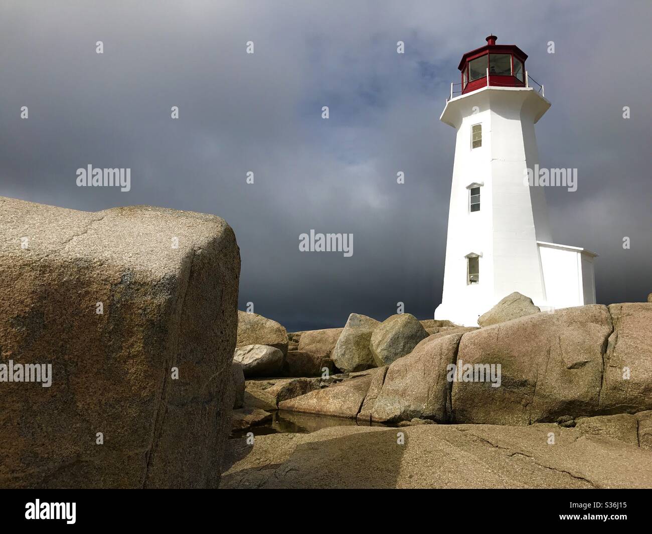 One of the most photographed lighthouses in the world, Peggy’s Cove Lighthouse, Nova Scotia, Canada Stock Photo