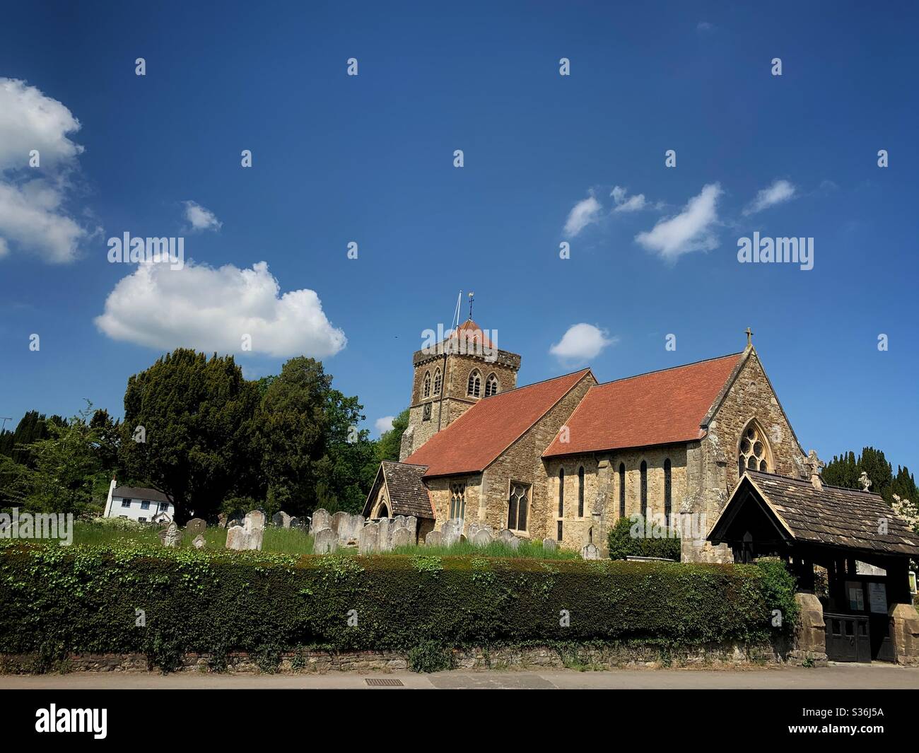 St. Mary’s church in Chiddingfold village in Surrey, England. Stock Photo