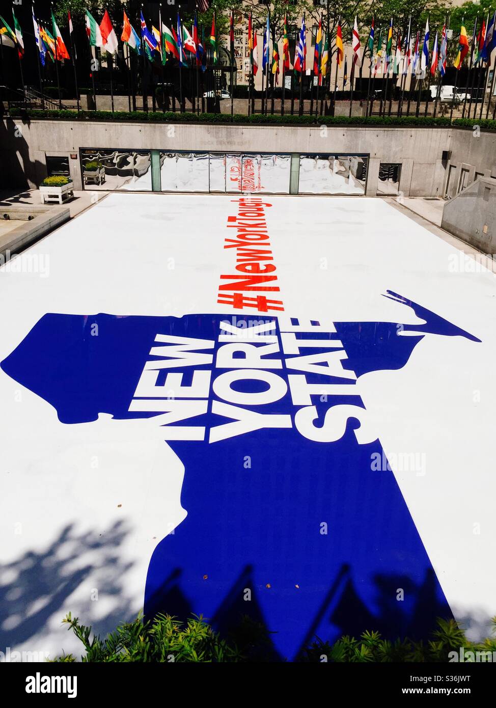The skating rink at Rockefeller Center is decorated with an inspirational saying during the coronavirus sanctions, #NewYorkTough,NYC,USA - Smartphone Captured Stock Image