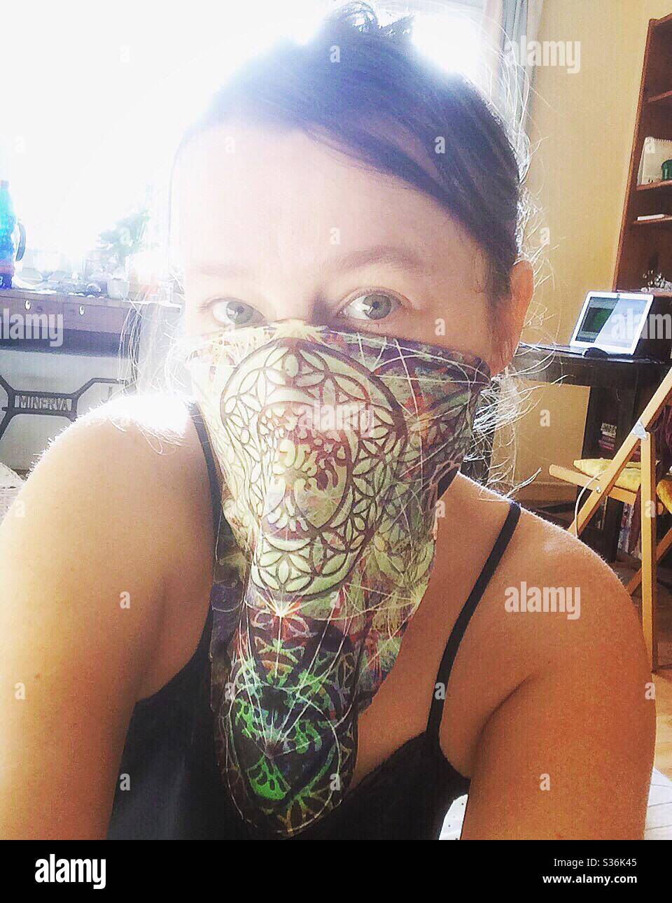 Woman with scarf face mask on her face Stock Photo Alamy