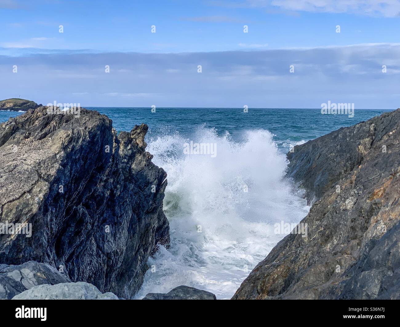 Big surf crashing in between the rocks - Smartphone Captured Stock Image