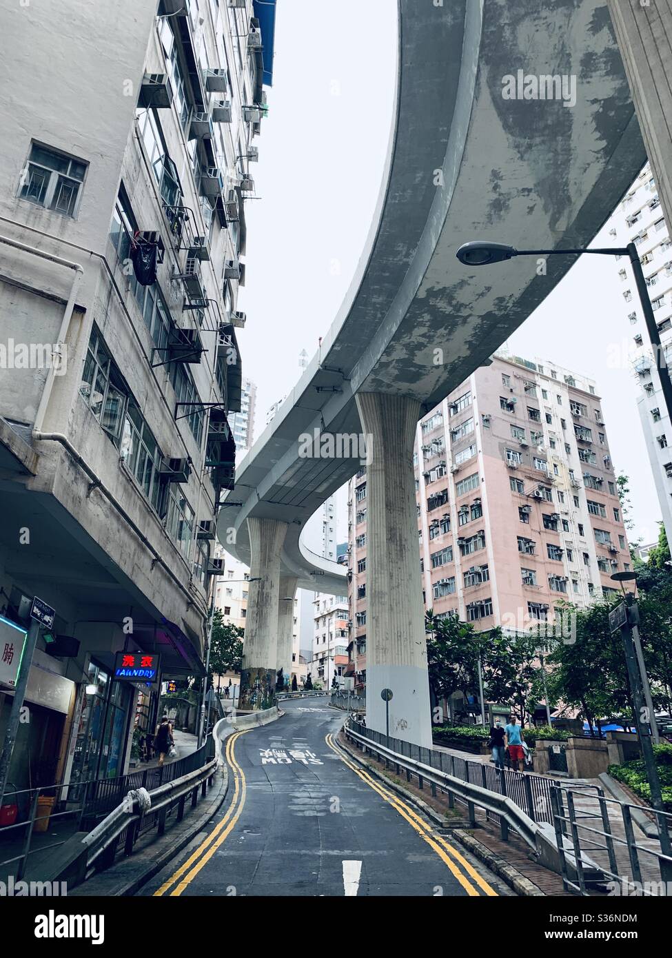 Under a giant flyover  surrounded by residential buildings. Stock Photo