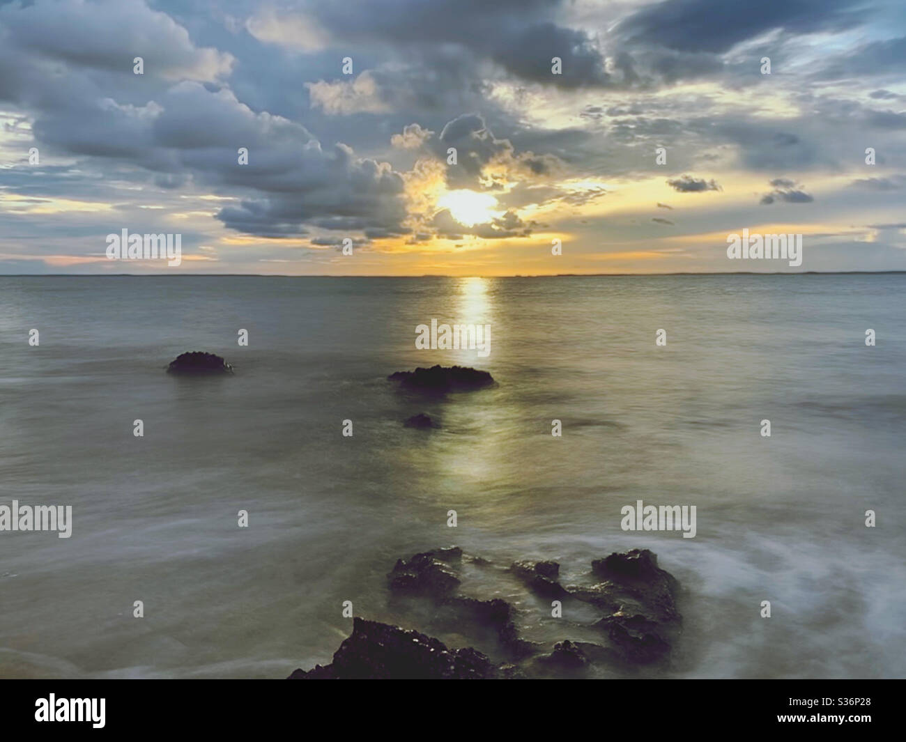 Long exposure: Sunset at The Beach Stock Photo