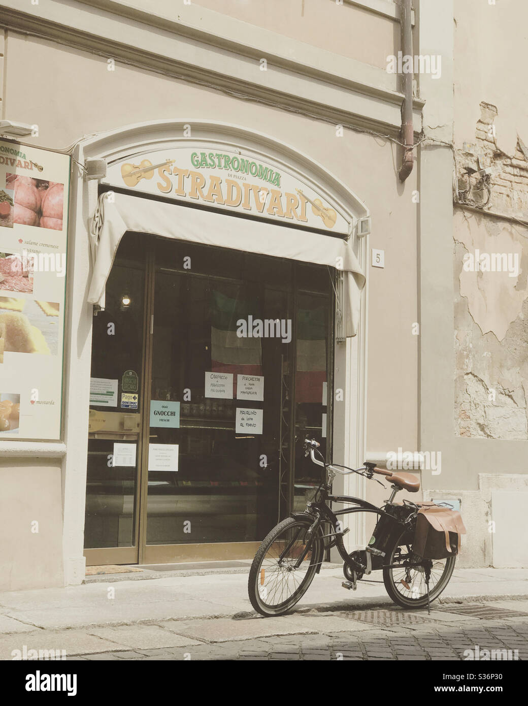 Italy street scene bicycle outside tipical food store - Smartphone Captured Stock Image