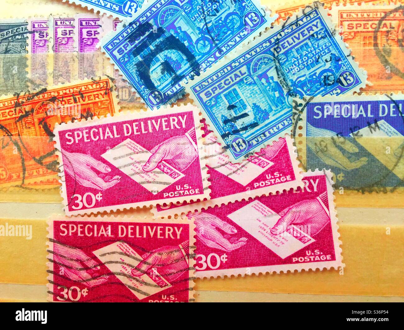 Special delivery stamps from the 1950s and 60s in a stamp collectors stock book, USA - Smartphone Captured Stock Image