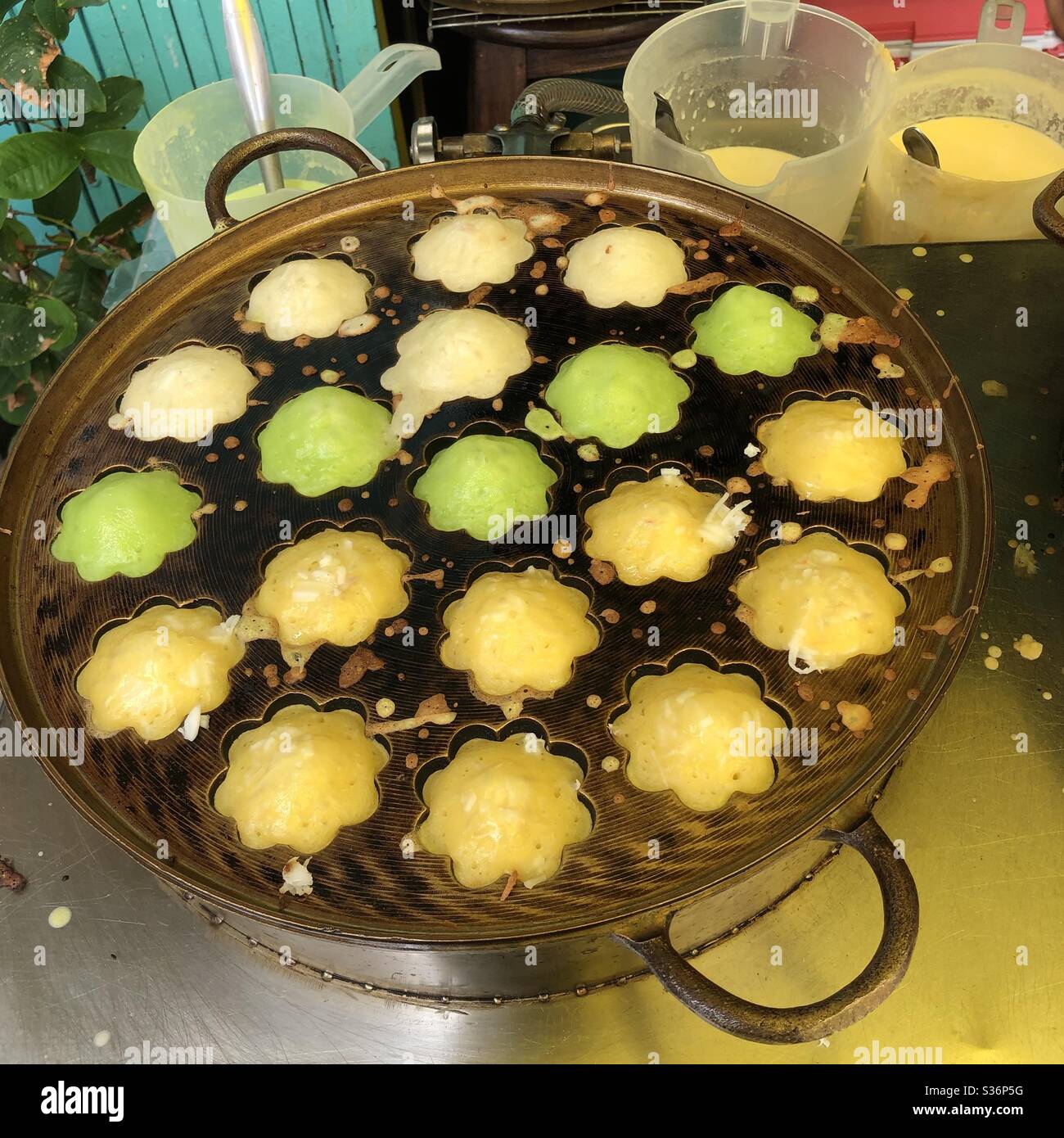 Thai dessert, A variety of coconut cakes in different flavor: Pandan cake in green, Palm cake in yellow and original in white. Stock Photo