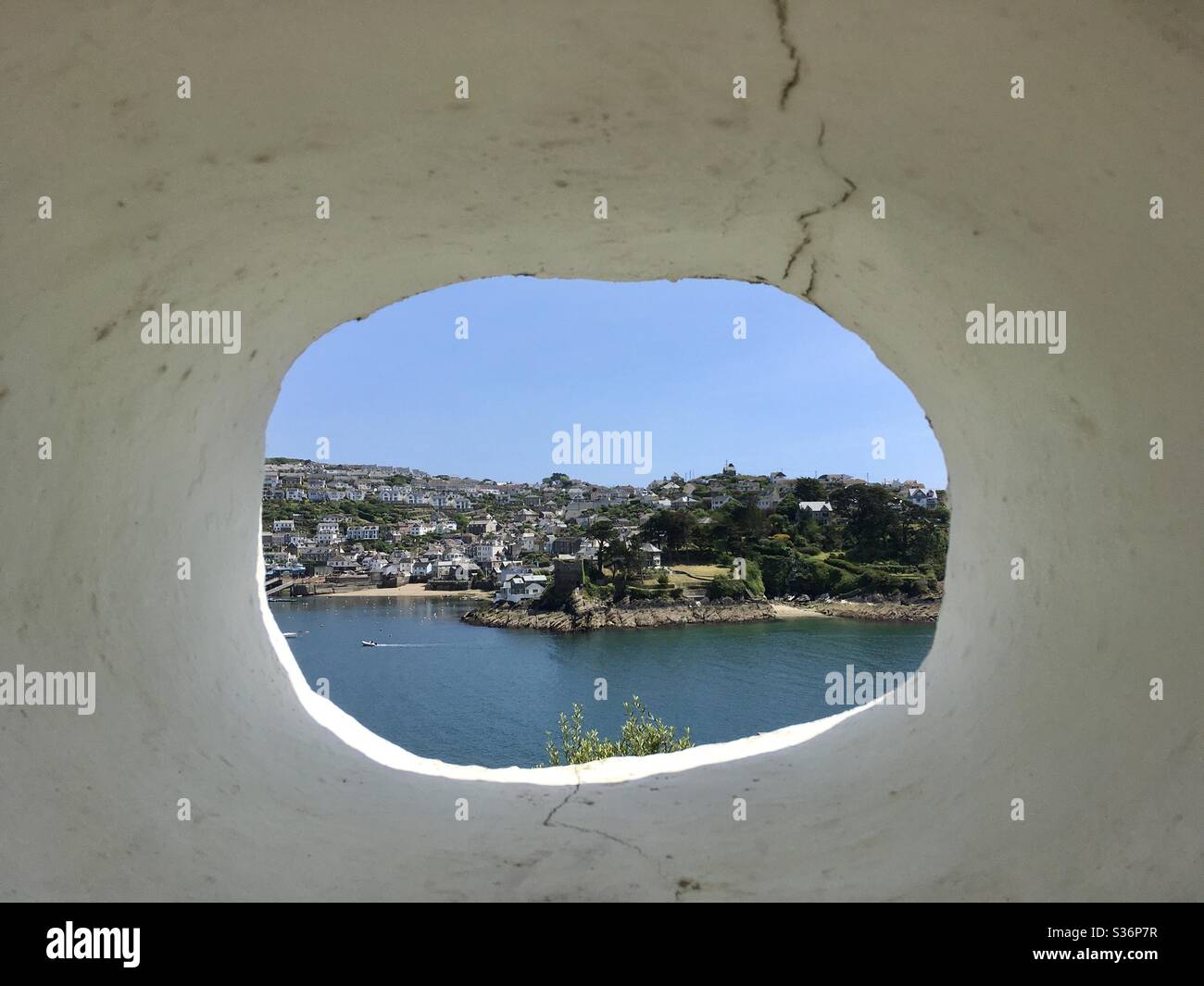 Fowey, Cornwall, looking through a round window, over the River Fowey, to Polruan - Smartphone Captured Stock Image