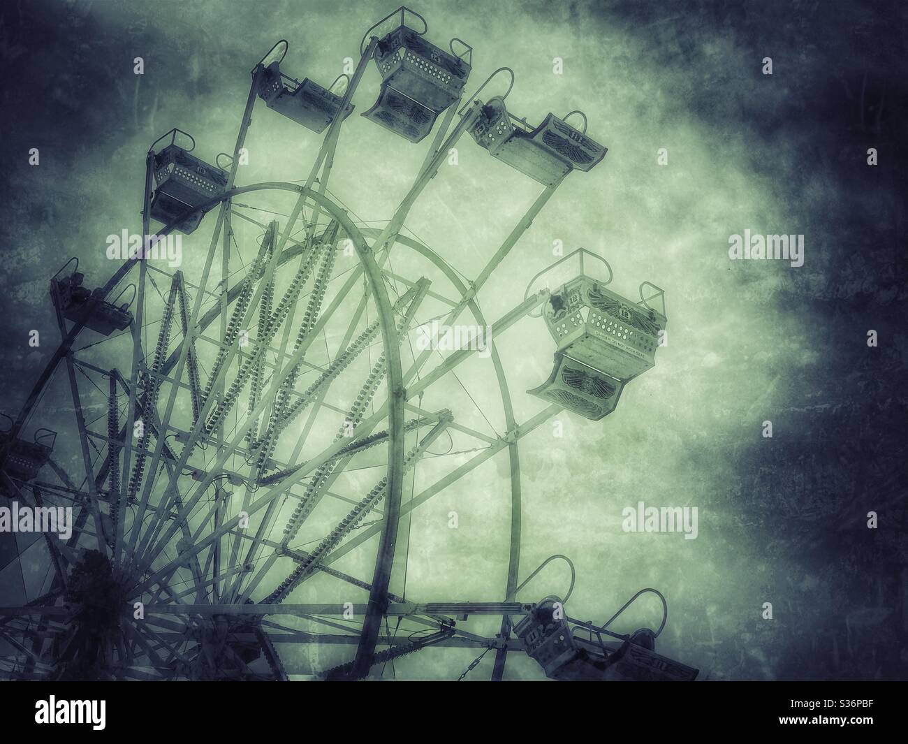 Moody carnival ride with textured sky - Smartphone Captured Stock Image