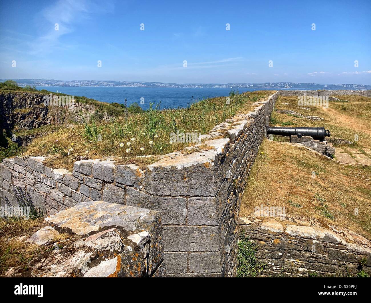Berry head Napoleonic fort with a black cannon gun. - Smartphone Captured Stock Image
