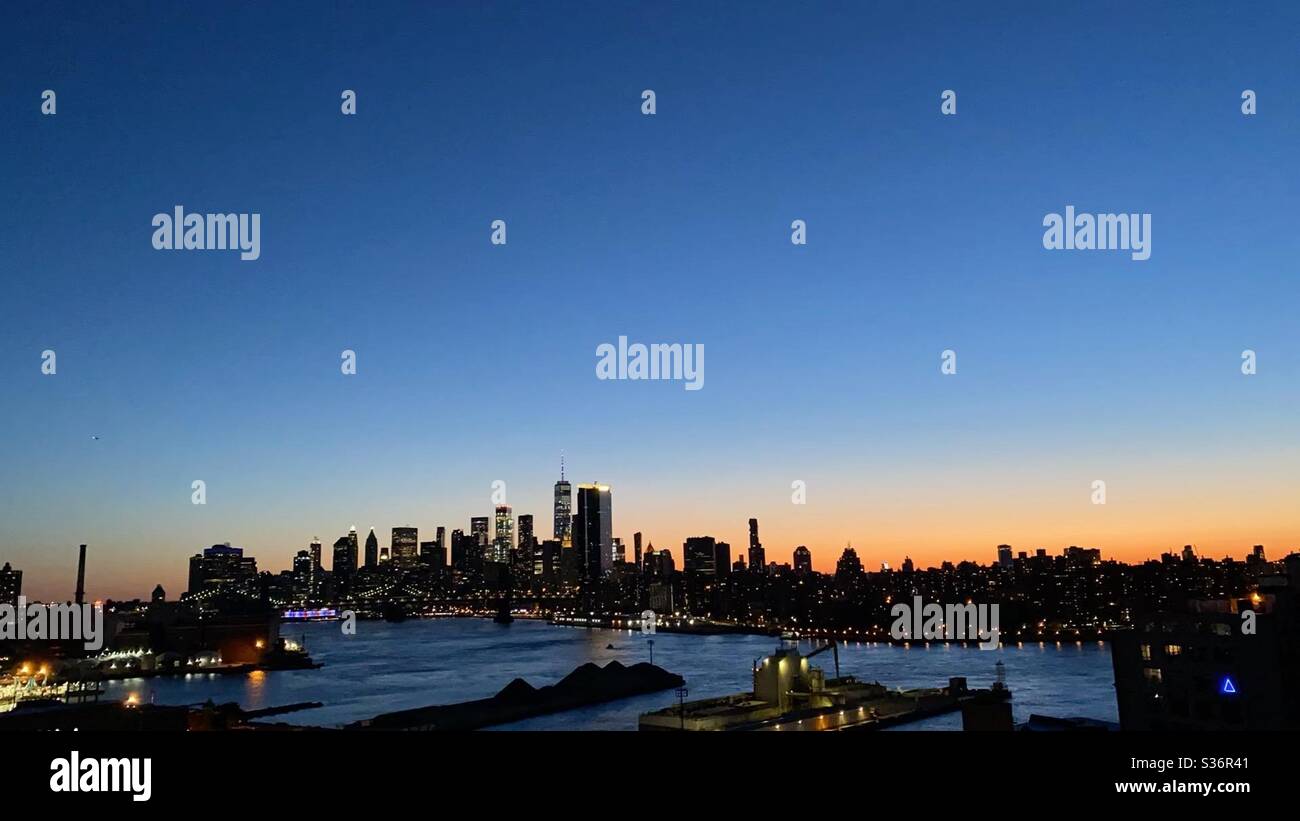 NYC sunset overlooking lower Manhattan from Brooklyn bridges, on the ...