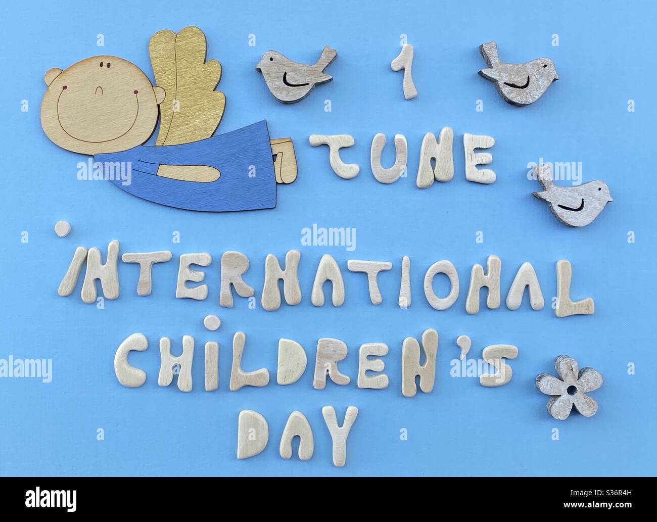 1 june, international childrens day background for a greeting card. kids day poster with wooden handmade letters and objects Stock Photo