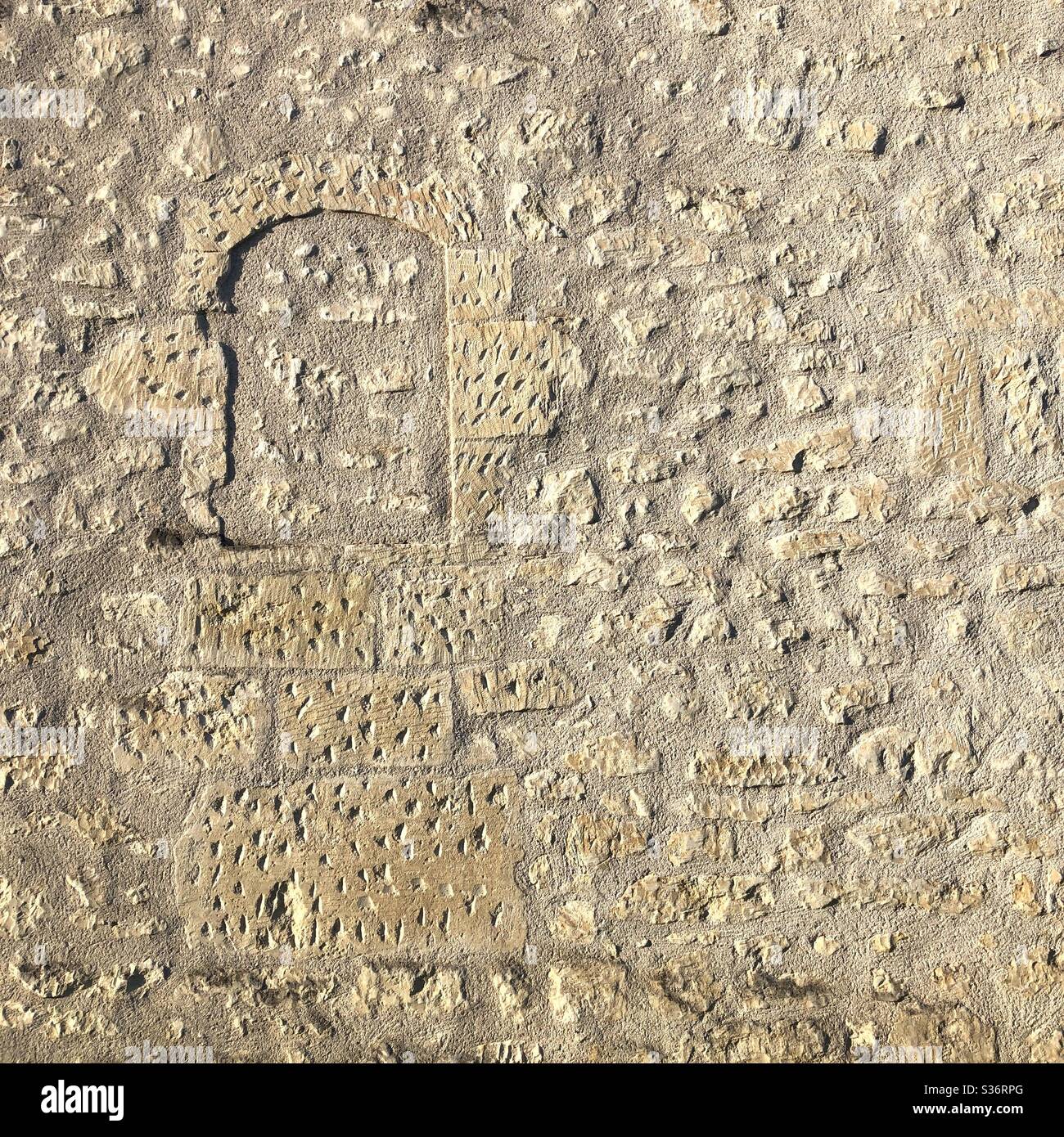 Old blocked-up window in wall of French stone house. - Smartphone Captured Stock Image