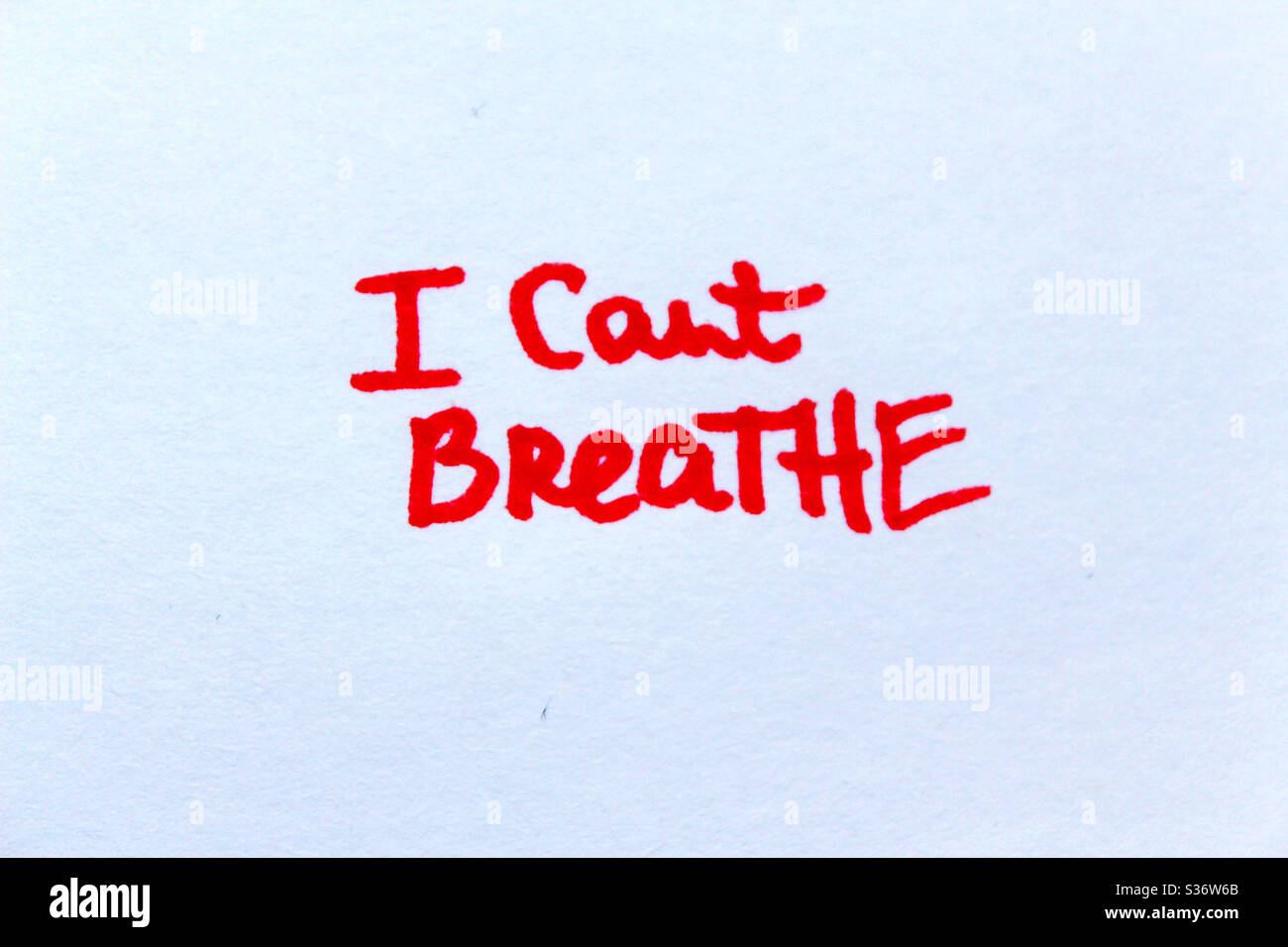 I Can’t Breathe. Handwritten message in red on a paper. Stock Photo