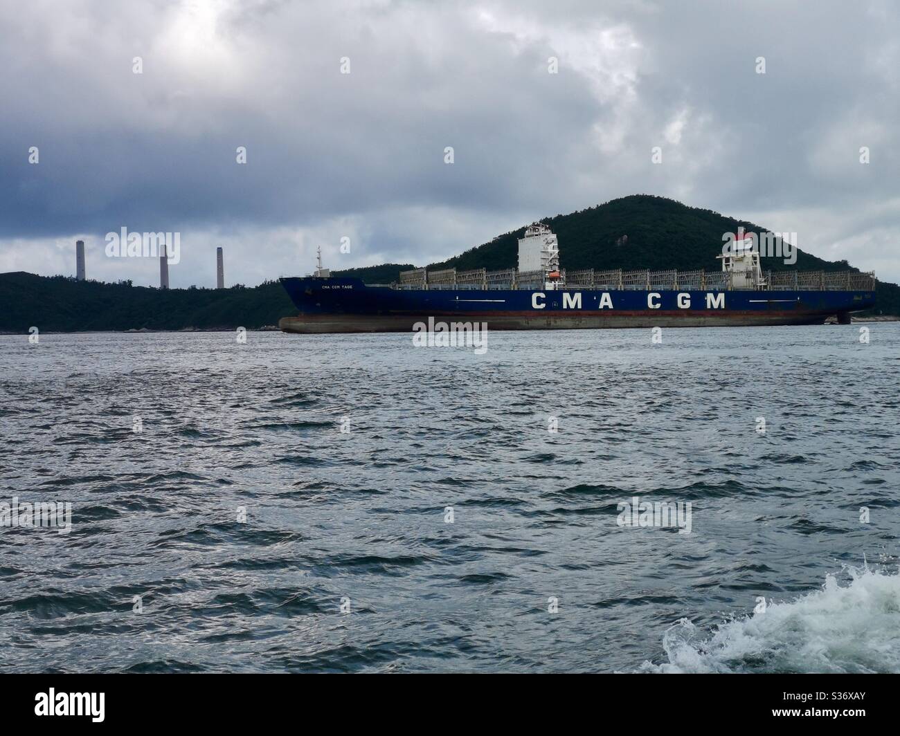 CMA CGM cargo ship crossing the East Lamma Channel in Hong Kong. - Smartphone Captured Stock Image