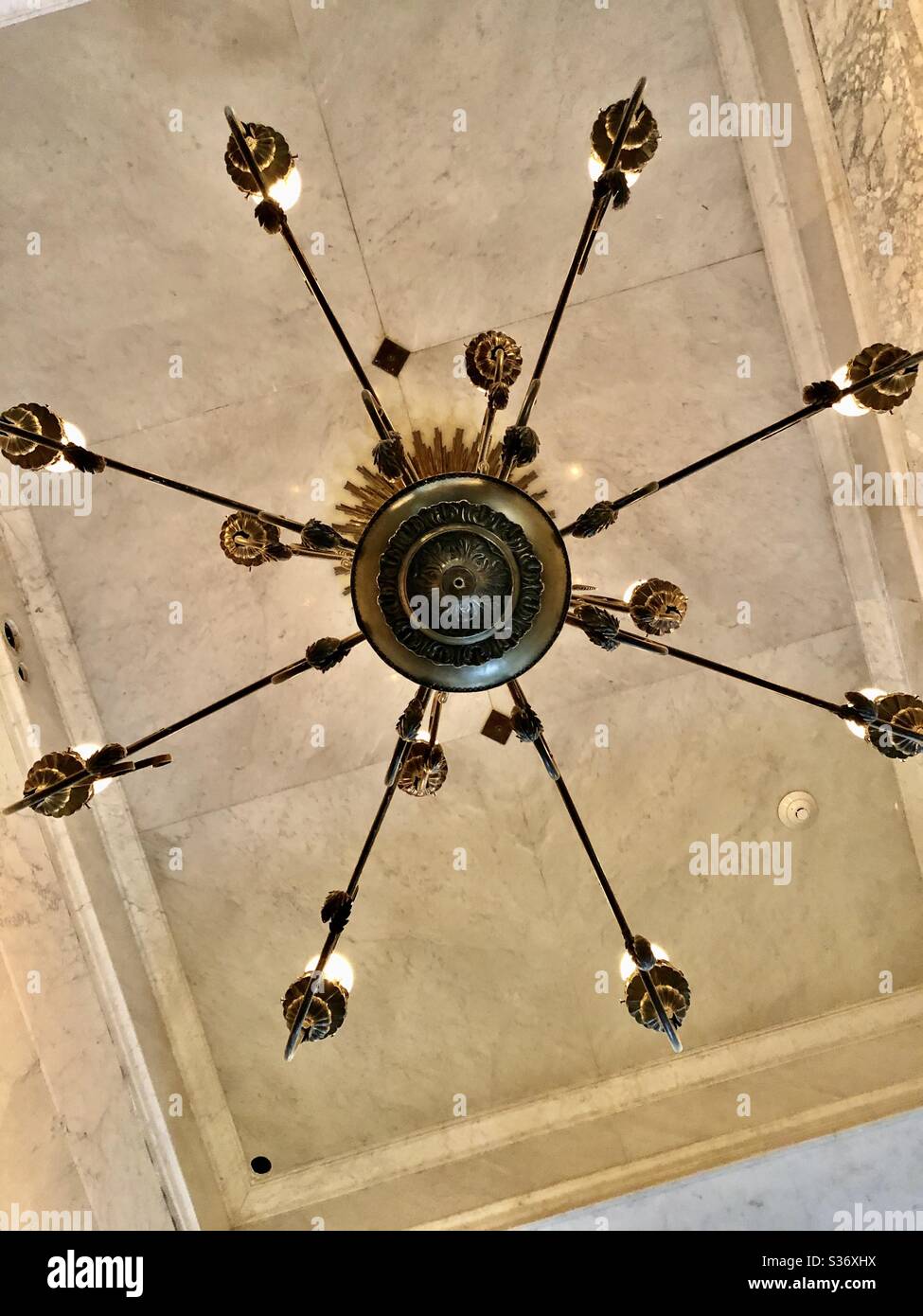 Old chandelier as viewed from below.  Banco Popular Building, Downtown Los Angeles May 2020 Stock Photo