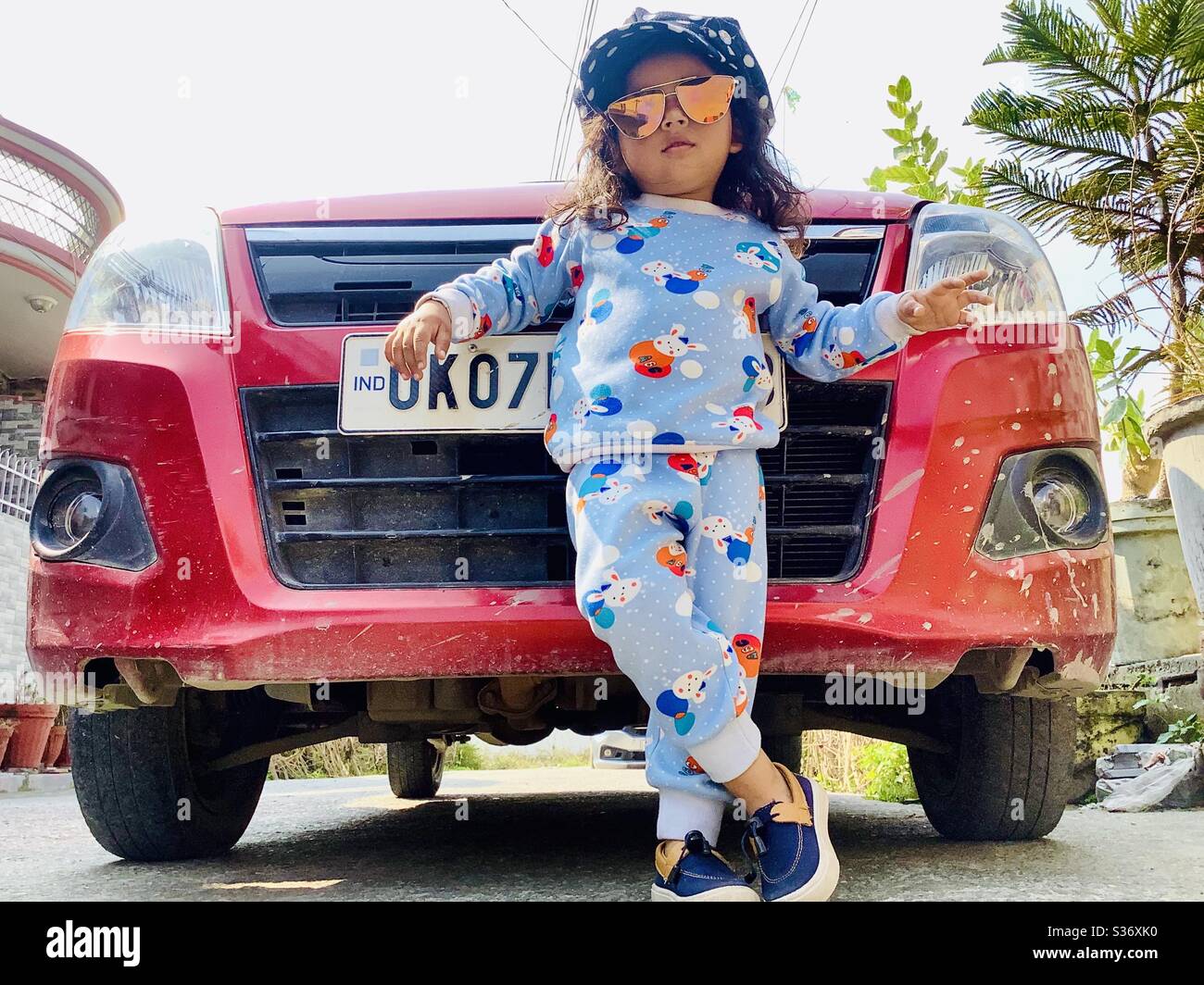 Premium Photo | Solid asian man in white shirt and sunglasses posed near  black mafia suv car.