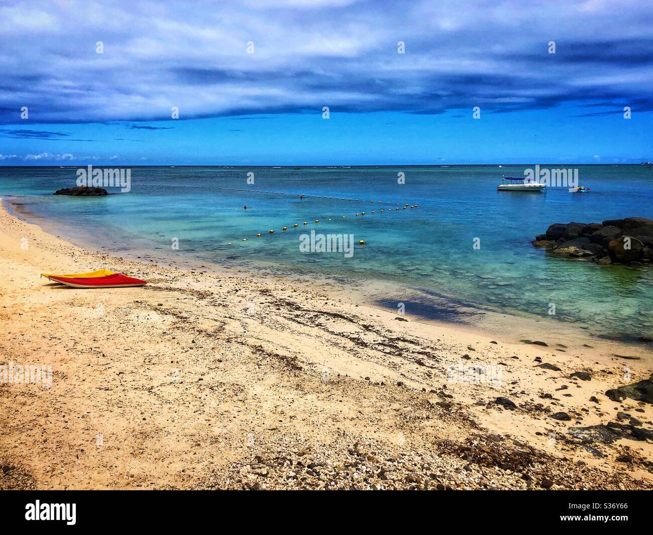 Tropical beach with boats in Mauritius. - Smartphone Captured Stock Image