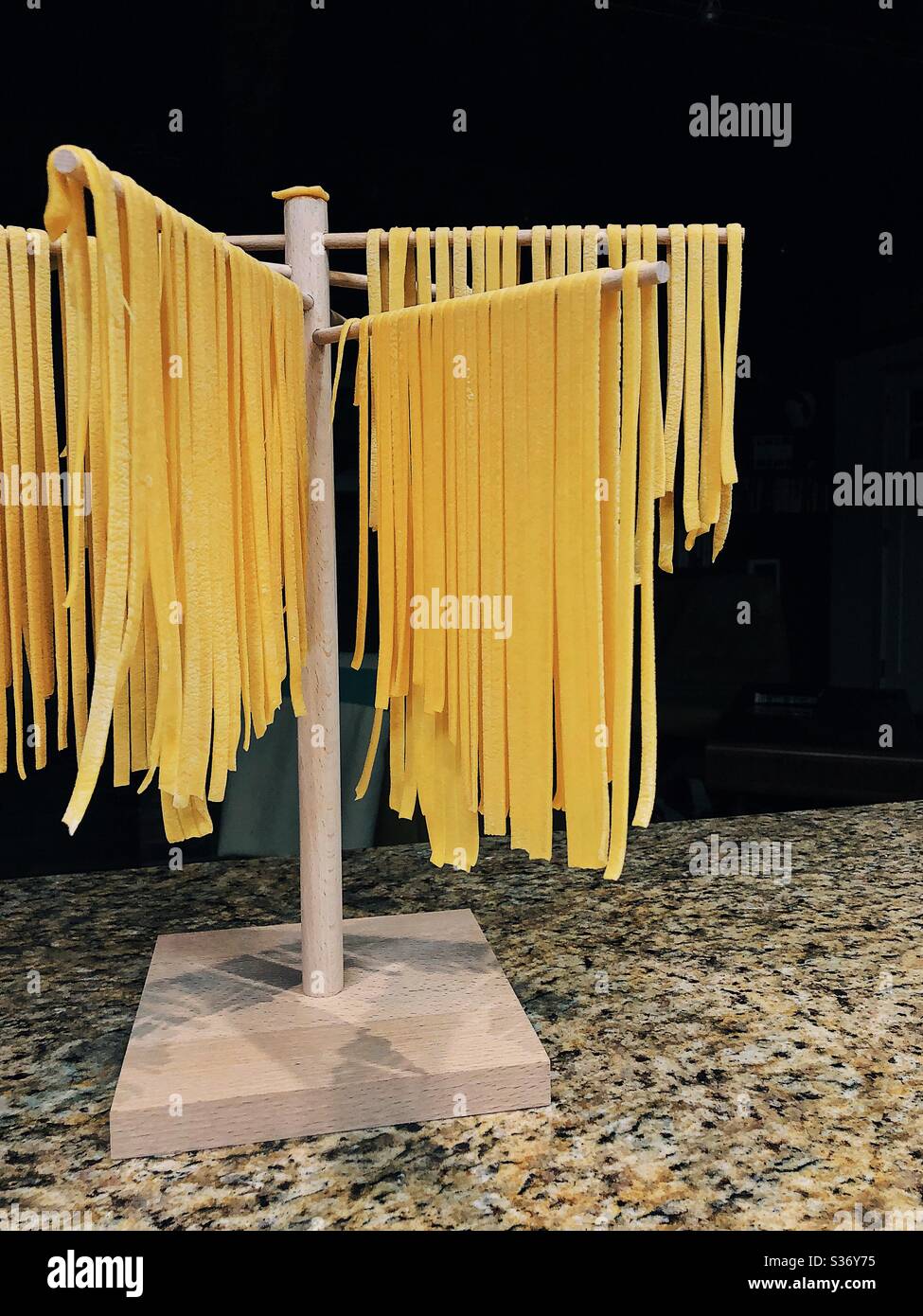 Fresh handmade pasta drying on a drying rack Stock Photo Alamy