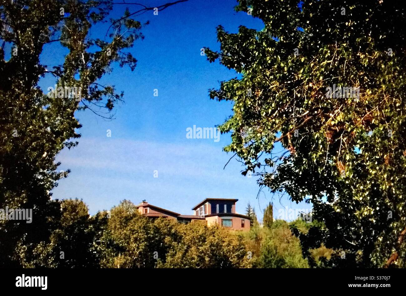 View lot mansion, Bow River, Policeman’s Flats Park, Calgary, Alberta, Canada - Smartphone Captured Stock Image