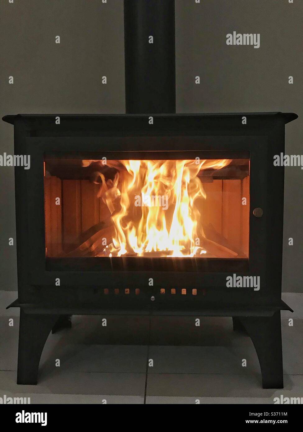 Wood-burning home fireplace. - Smartphone Captured Stock Image