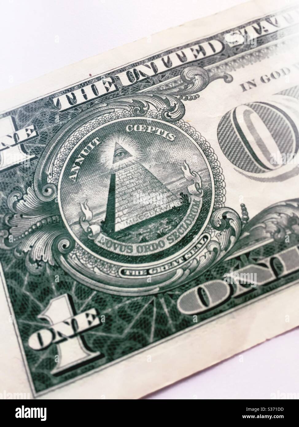 Close up of the reverse side of the one dollar US currency bill shows the all seeing pyramid, USA - Smartphone Captured Stock Image