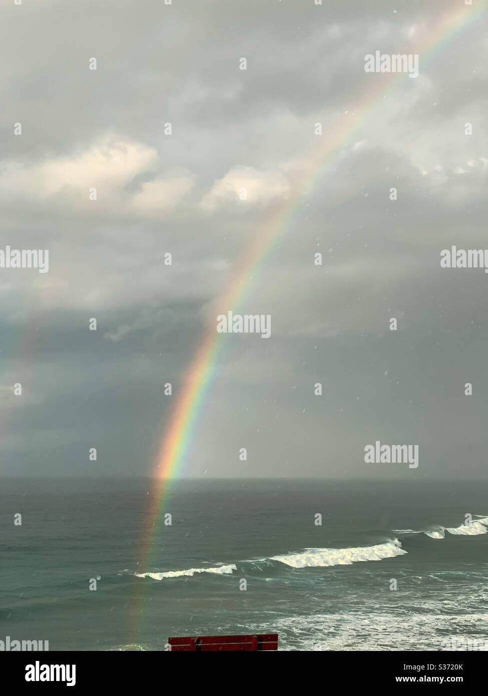 Rainbow reflected in the ocean - Smartphone Captured Stock Image