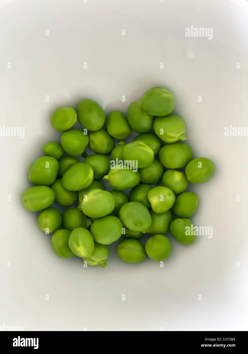 Macro of a bunch of Green peas Stock Photo Alamy