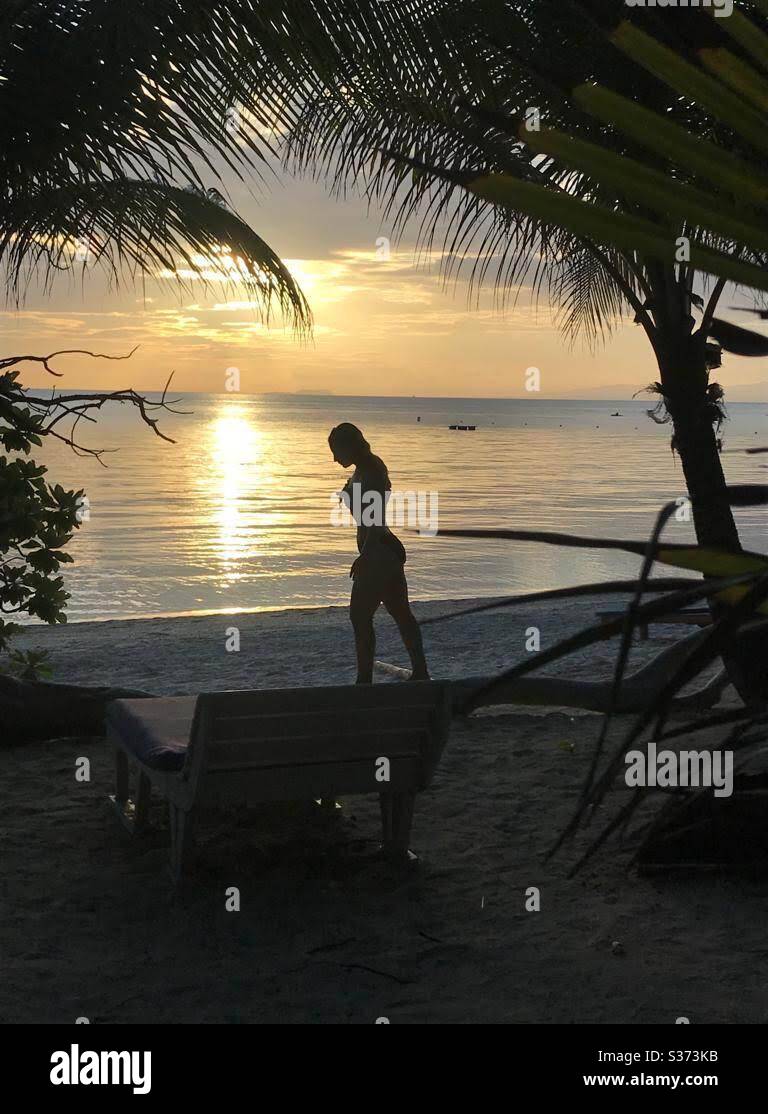 Silhouette of a woman on the beach in Siquijor, Philippines. Stock Photo