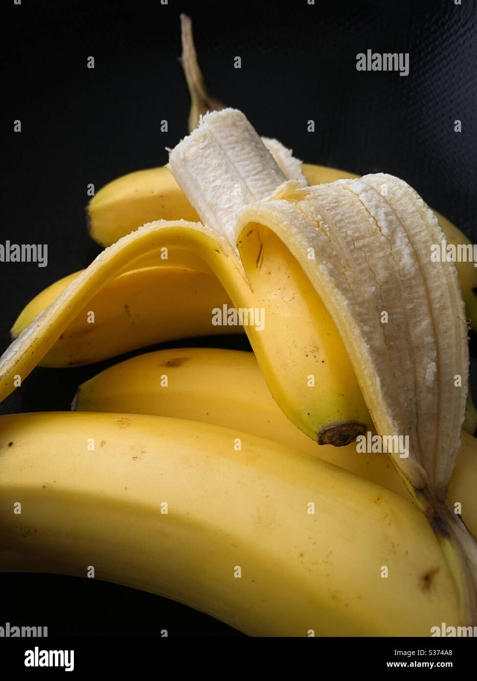 Banana for a snack Stock Photo - Alamy