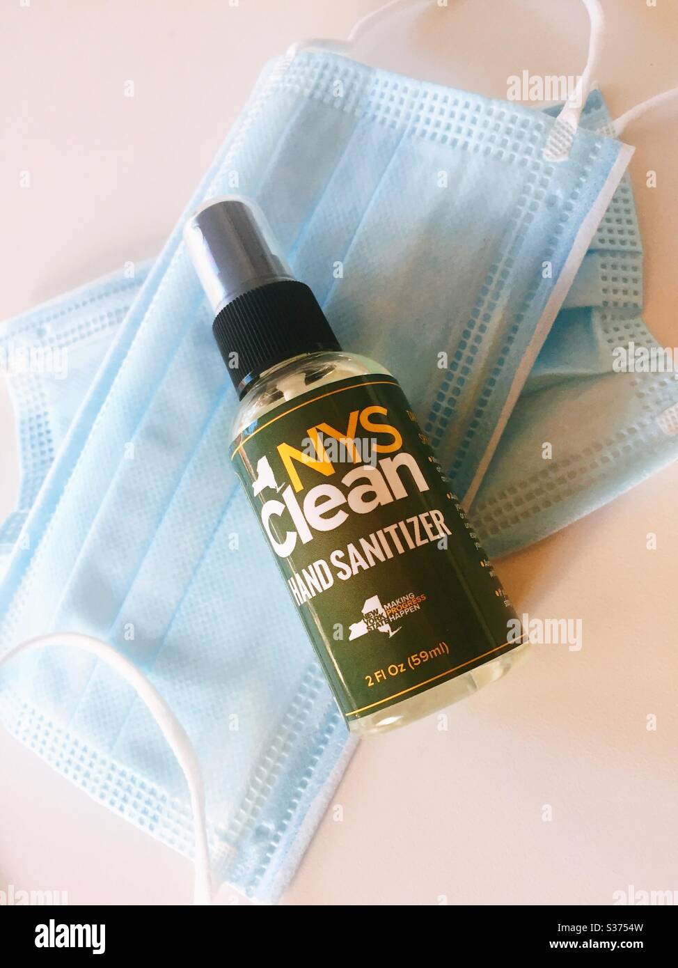 Hand sanitizer bottles and protective face masks are being given away free to the public by New York state during the COVID-19 crisis, 2020, NYC, USA - Smartphone Captured Stock Image