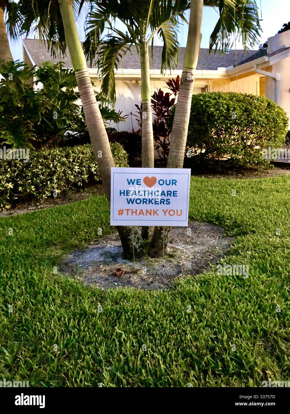 We Love Our Healthcare Workers Thank You# sign on a front lawn during Coronavirus Pandemic in Florida. - Smartphone Captured Stock Image