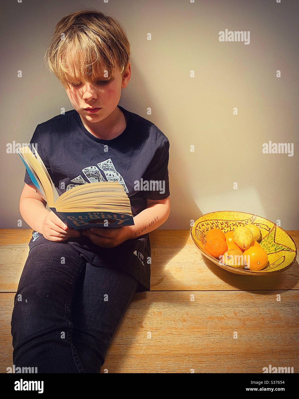 Boy reading - Smartphone Captured Stock Image