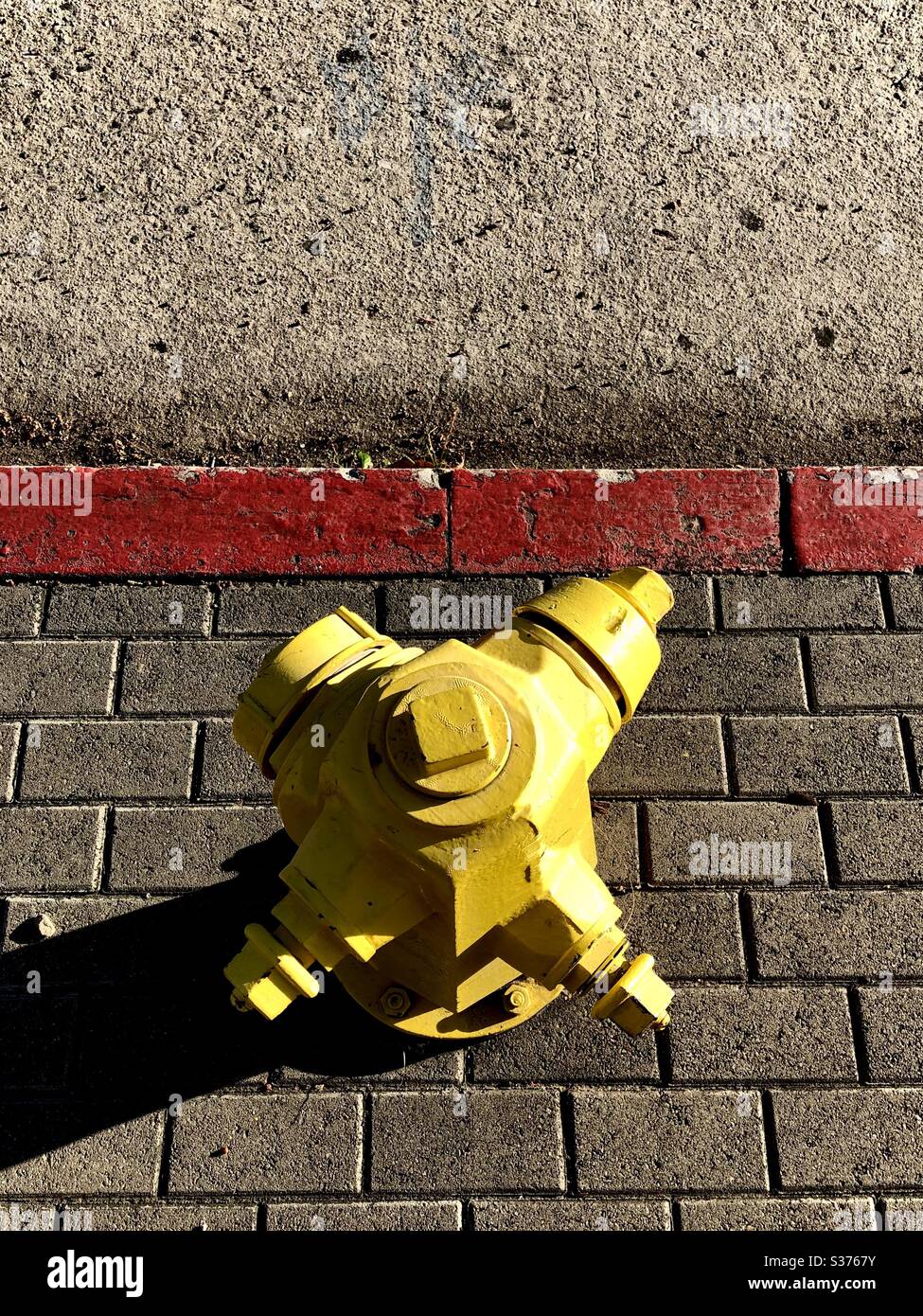 Vibrant fire hydrant wearing a fresh coat of paint in Los Angeles CA 6.13.2020 Stock Photo