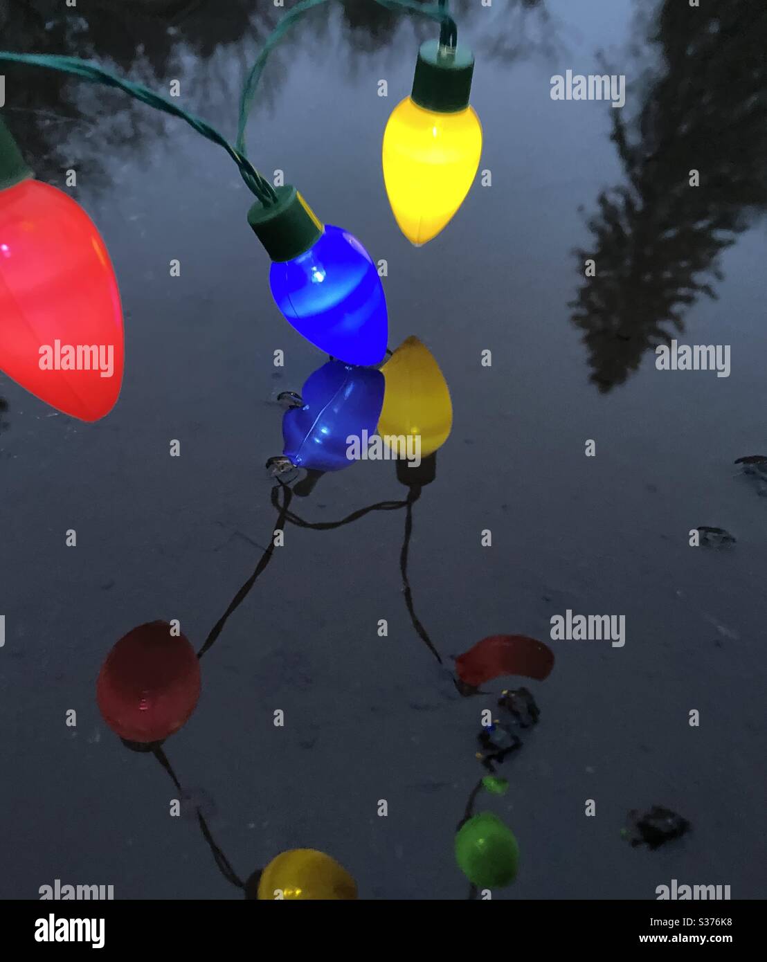 Colorful light chain with reflection Stock Photo Alamy