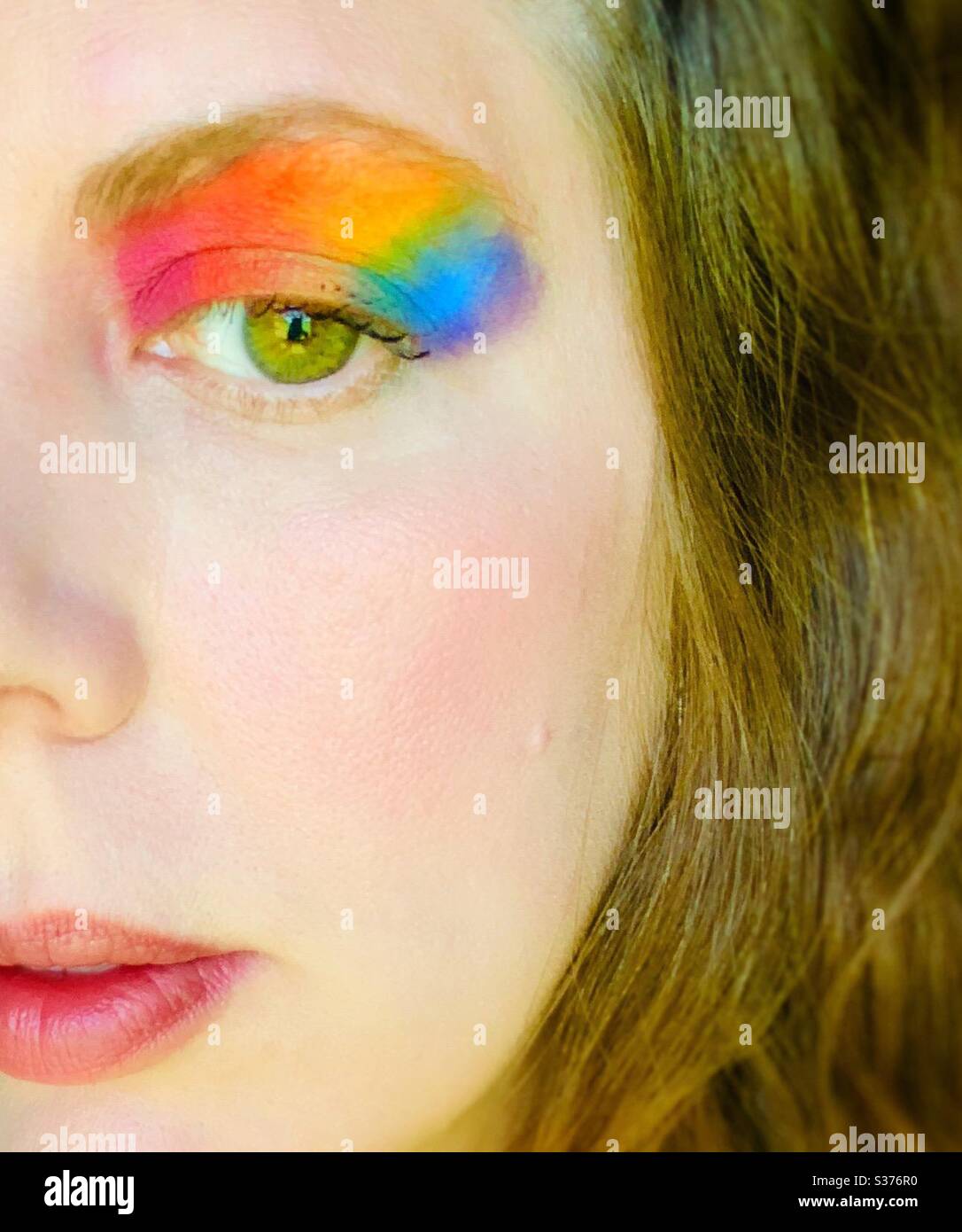 Rainbow eye makeup Stock Photo - Alamy