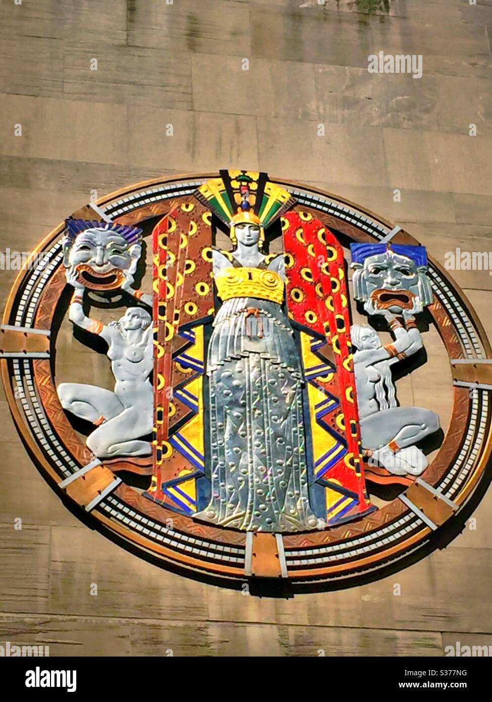 Openwork plaque on radio city music Hall, dance, drama and song, Rockefeller Center, New York City, USA - Smartphone Captured Stock Image