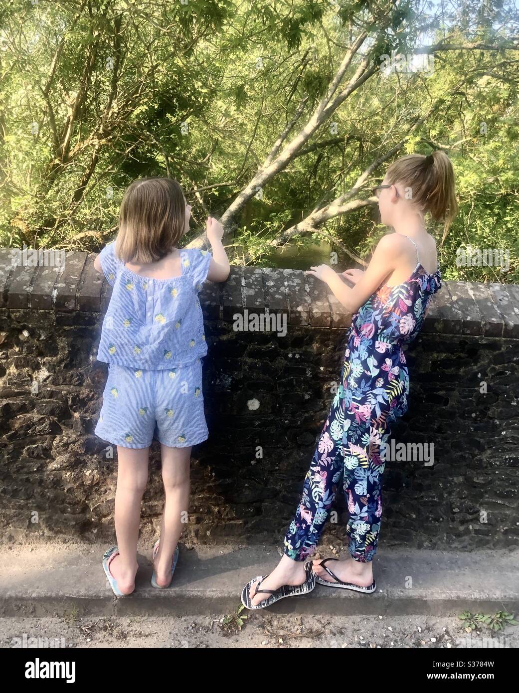 Sister on a bridge talking - Smartphone Captured Stock Image
