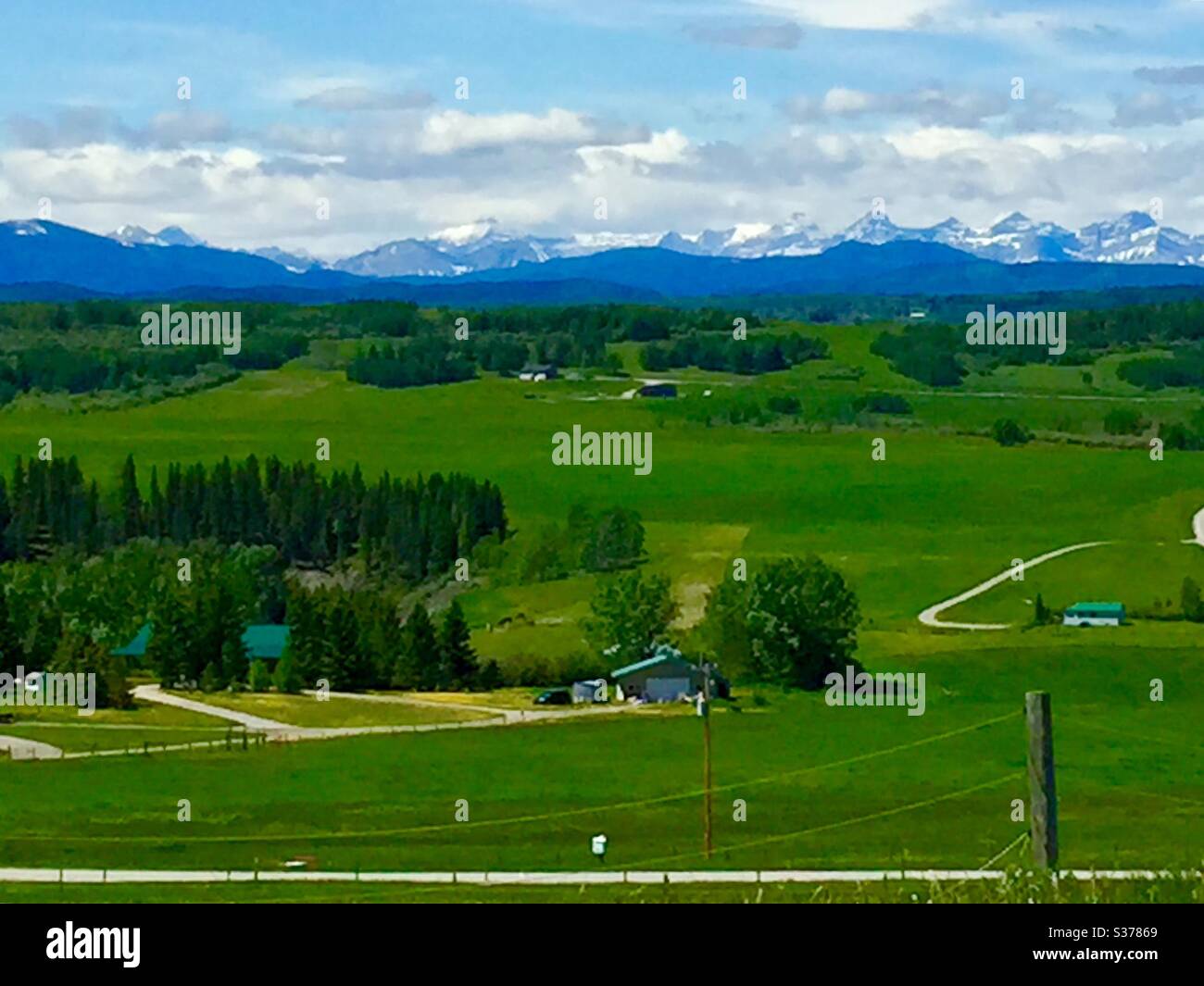 Canadian Rocky Mountains, and foothills ,landscape, farm buildings - Smartphone Captured Stock Image