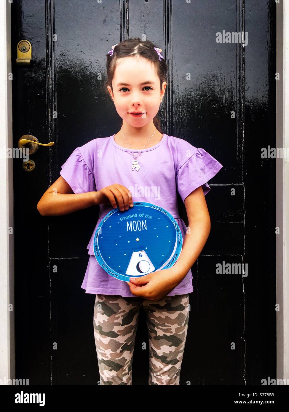 Phases of the moon (home schooling during Coronavirus lockdown 2020) - Smartphone Captured Stock Image