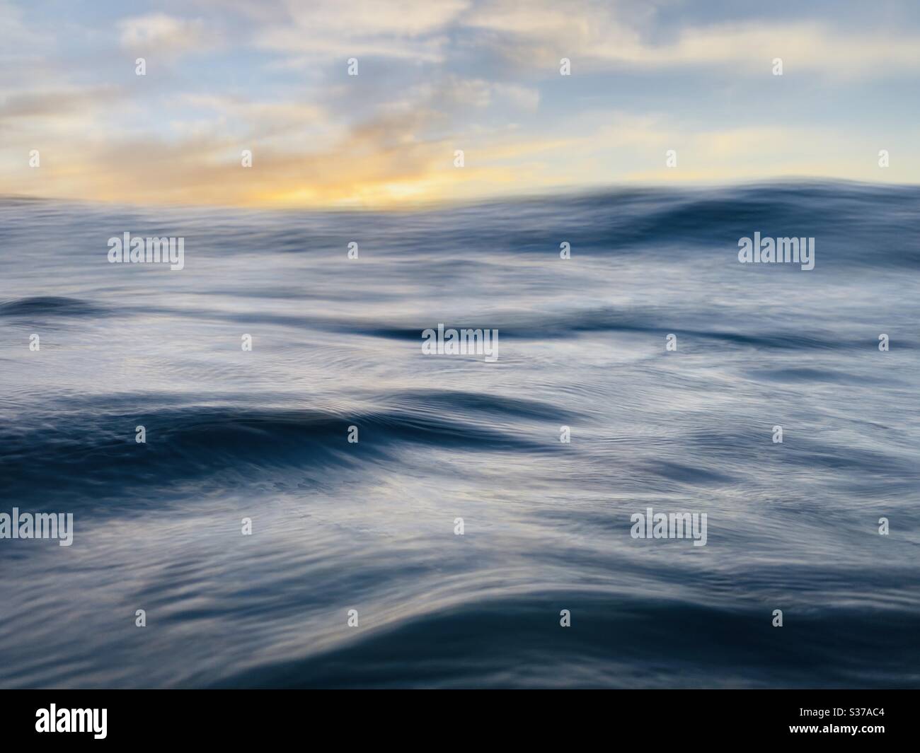 Ocean swells at sunset. - Smartphone Captured Stock Image