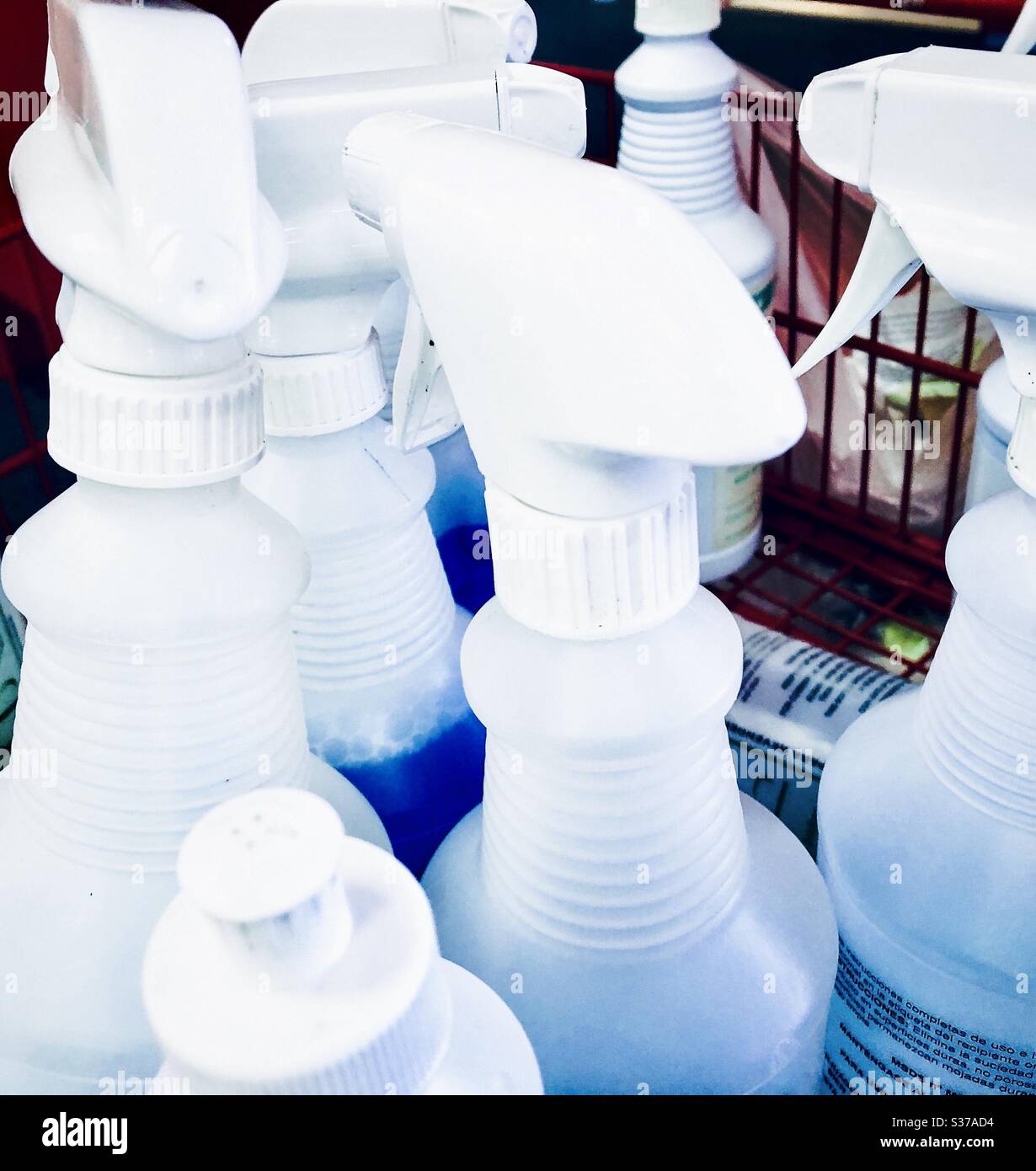 Spray bottles disinfectant for cleaning shopping carts retail store Stock Photo